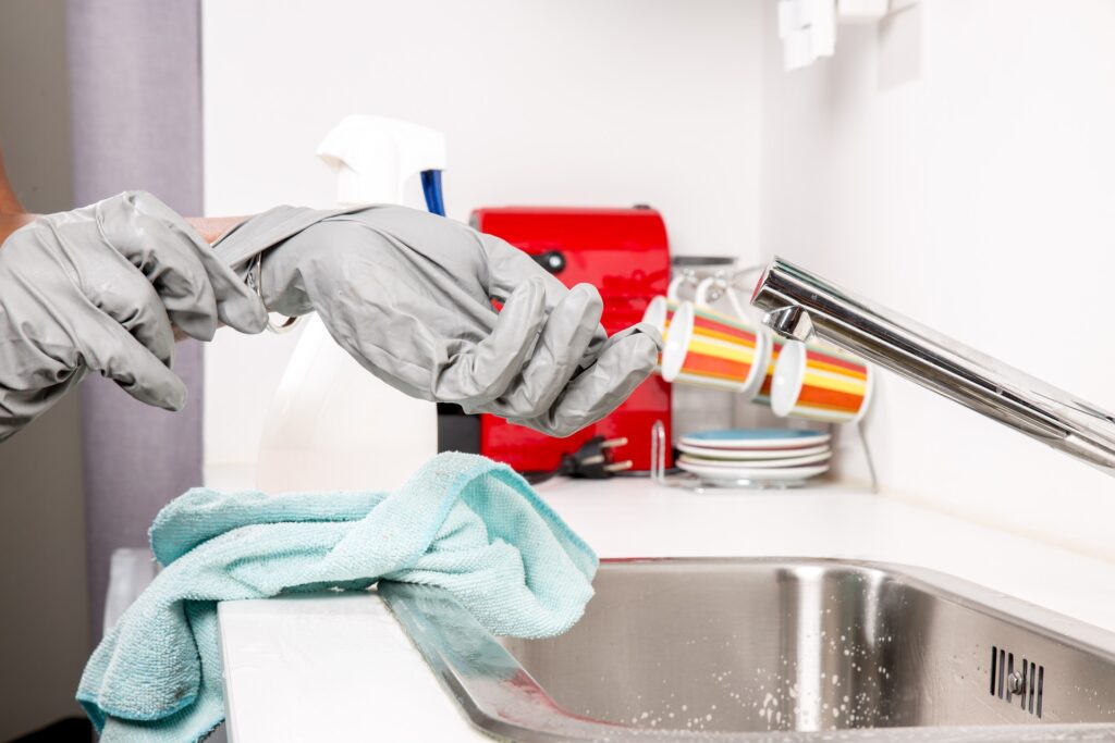Janitorial cleaning and sanitizing a commercal kitchen break room.