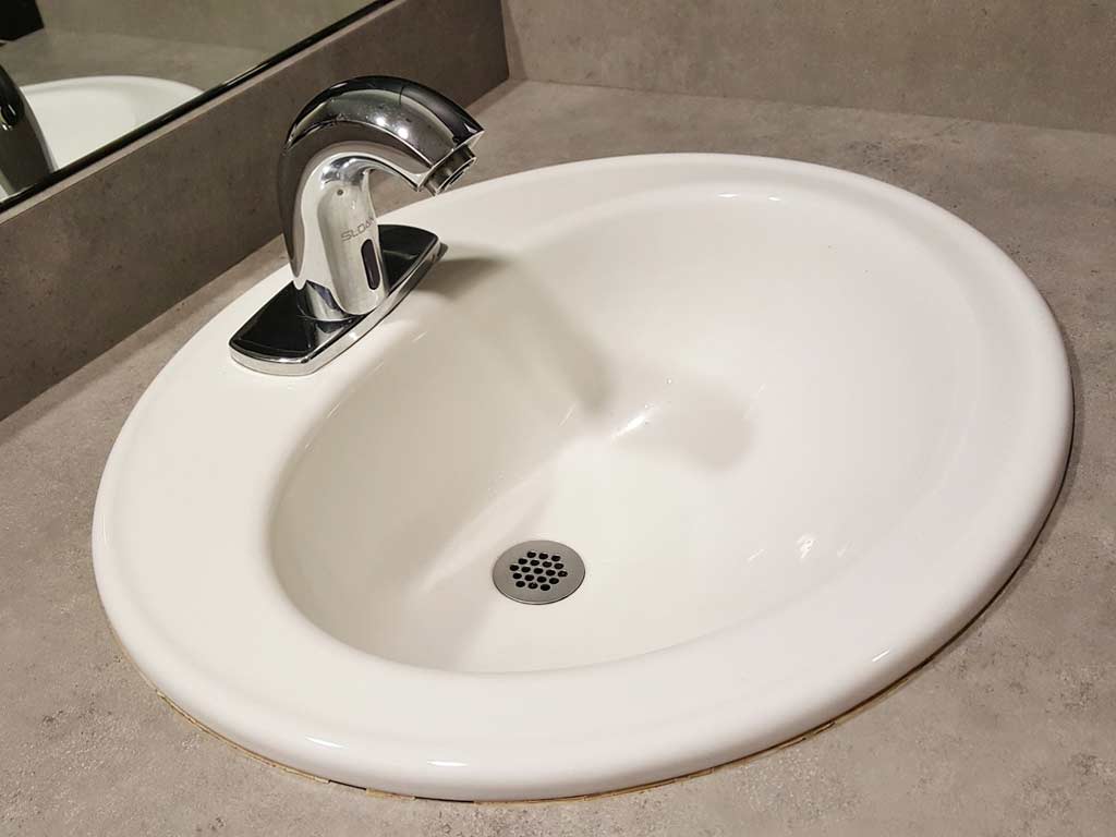 Sparkling clean lavatory basin by Andrew's Magic Touch Janitorial.