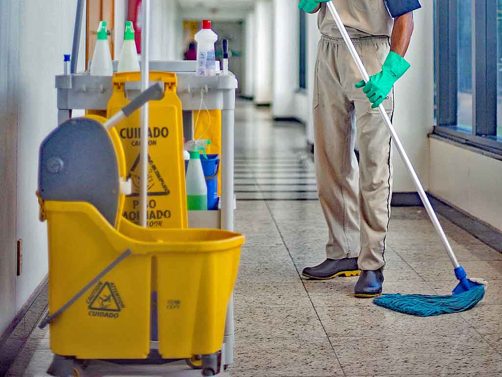 Andrew's Magic Touch team mopping a high traffic stone floor